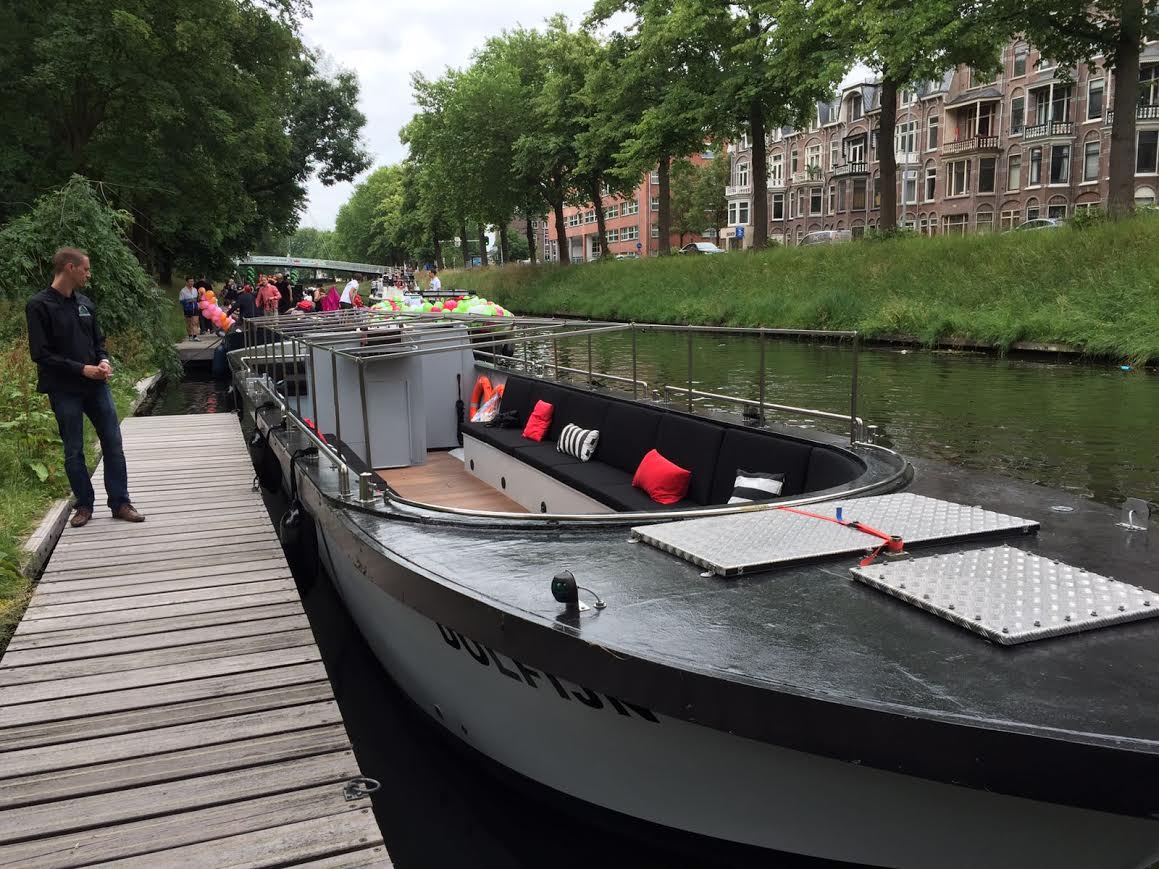 a boat is docked next to a body of water